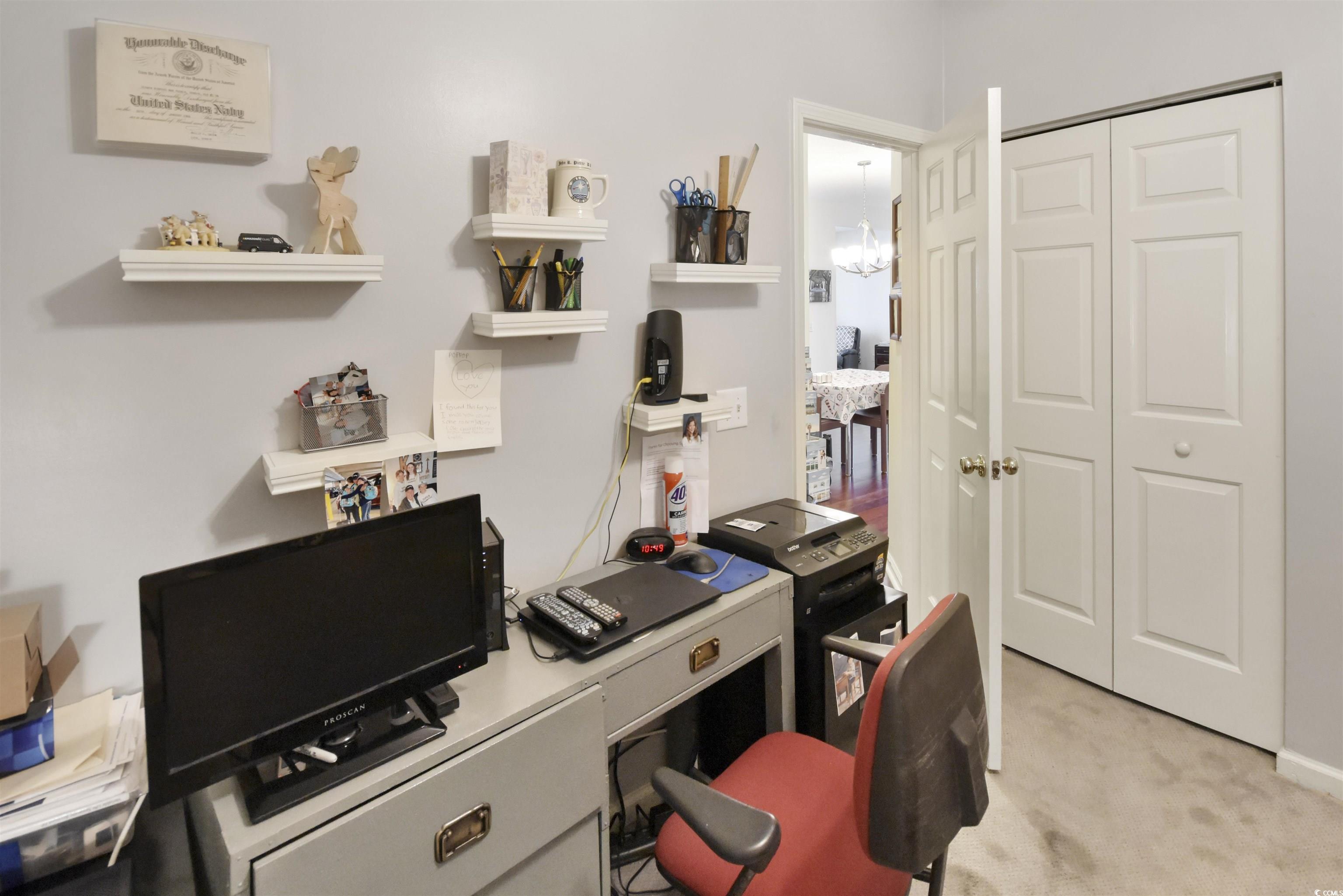4502 Sweetwater Boulevard, Unit 4502 Murrells Inlet, SC 29576 - Photo 20 of 28 Office space featuring light carpet and a chandelier