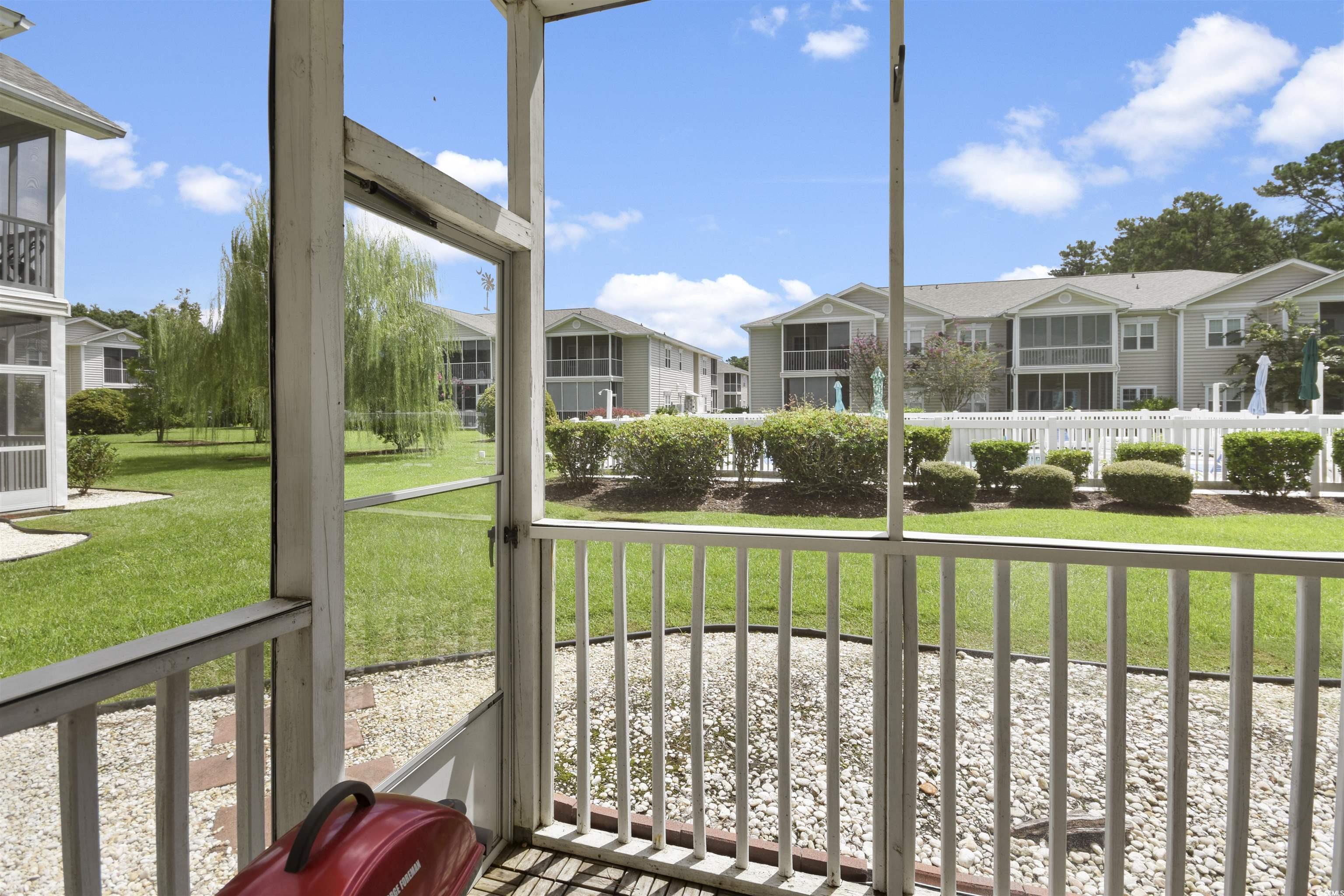4502 Sweetwater Boulevard, Unit 4502 Murrells Inlet, SC 29576 - Photo 23 of 28 Sunroom / solarium with a residential view