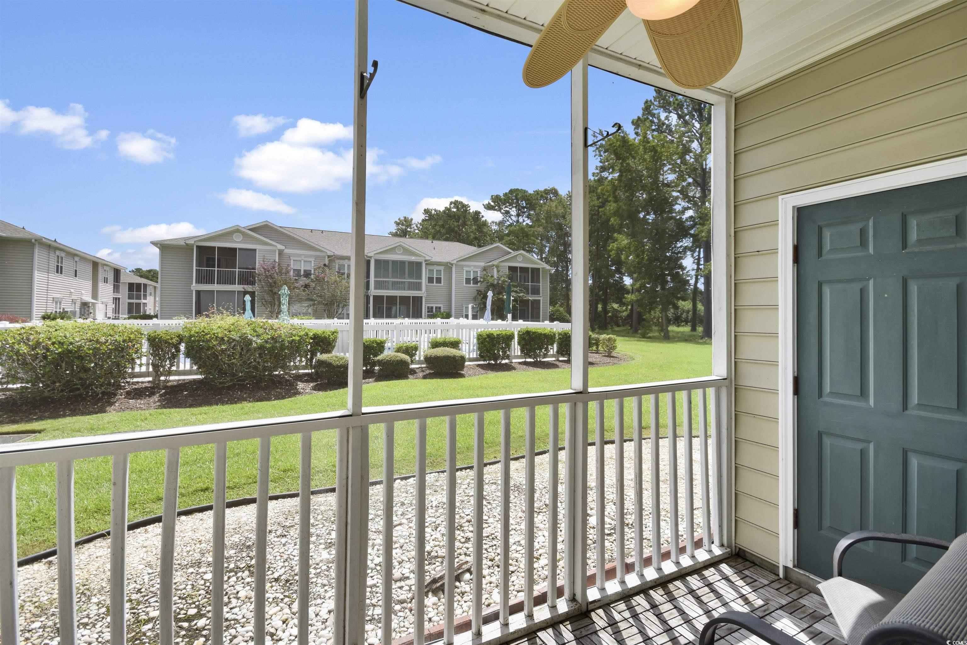 4502 Sweetwater Boulevard, Unit 4502 Murrells Inlet, SC 29576 - Photo 24 of 28 Sunroom / solarium with healthy amount of natural light and a ceiling fan