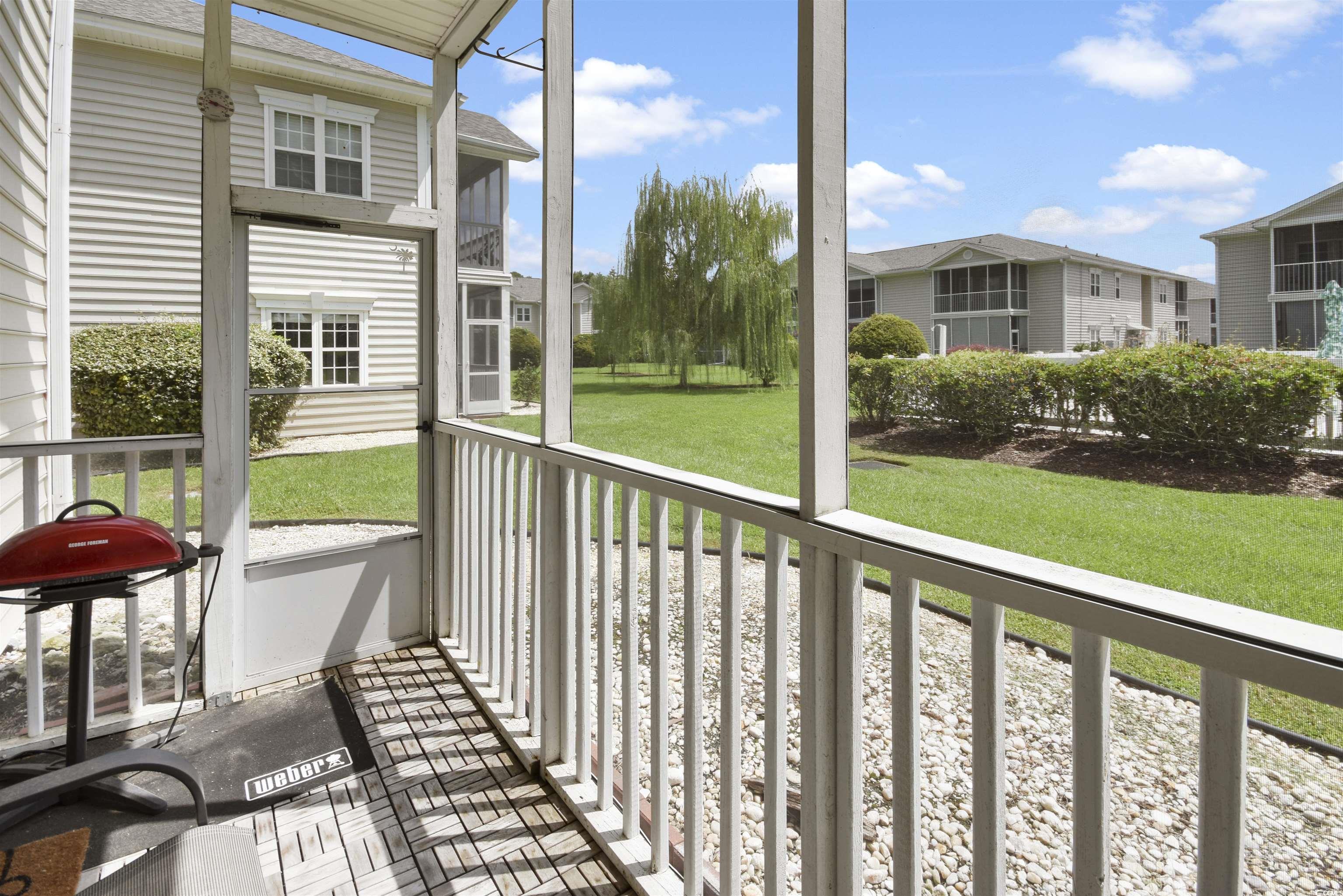 4502 Sweetwater Boulevard, Unit 4502 Murrells Inlet, SC 29576 - Photo 25 of 28 Unfurnished sunroom featuring a residential view