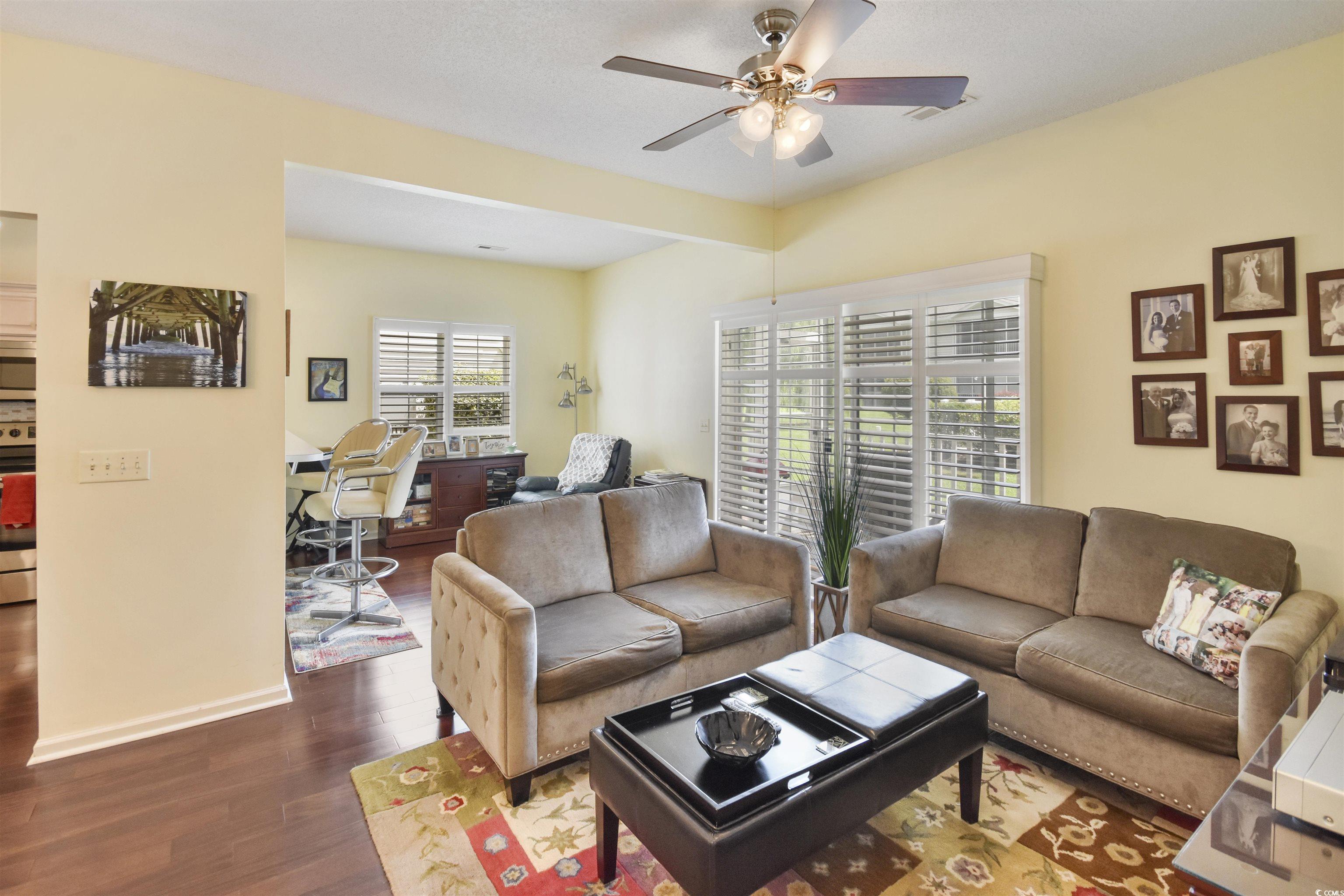 4502 Sweetwater Boulevard, Unit 4502 Murrells Inlet, SC 29576 - Photo 3 of 28 Living room with a desk, dark wood-style floors, and ceiling fan