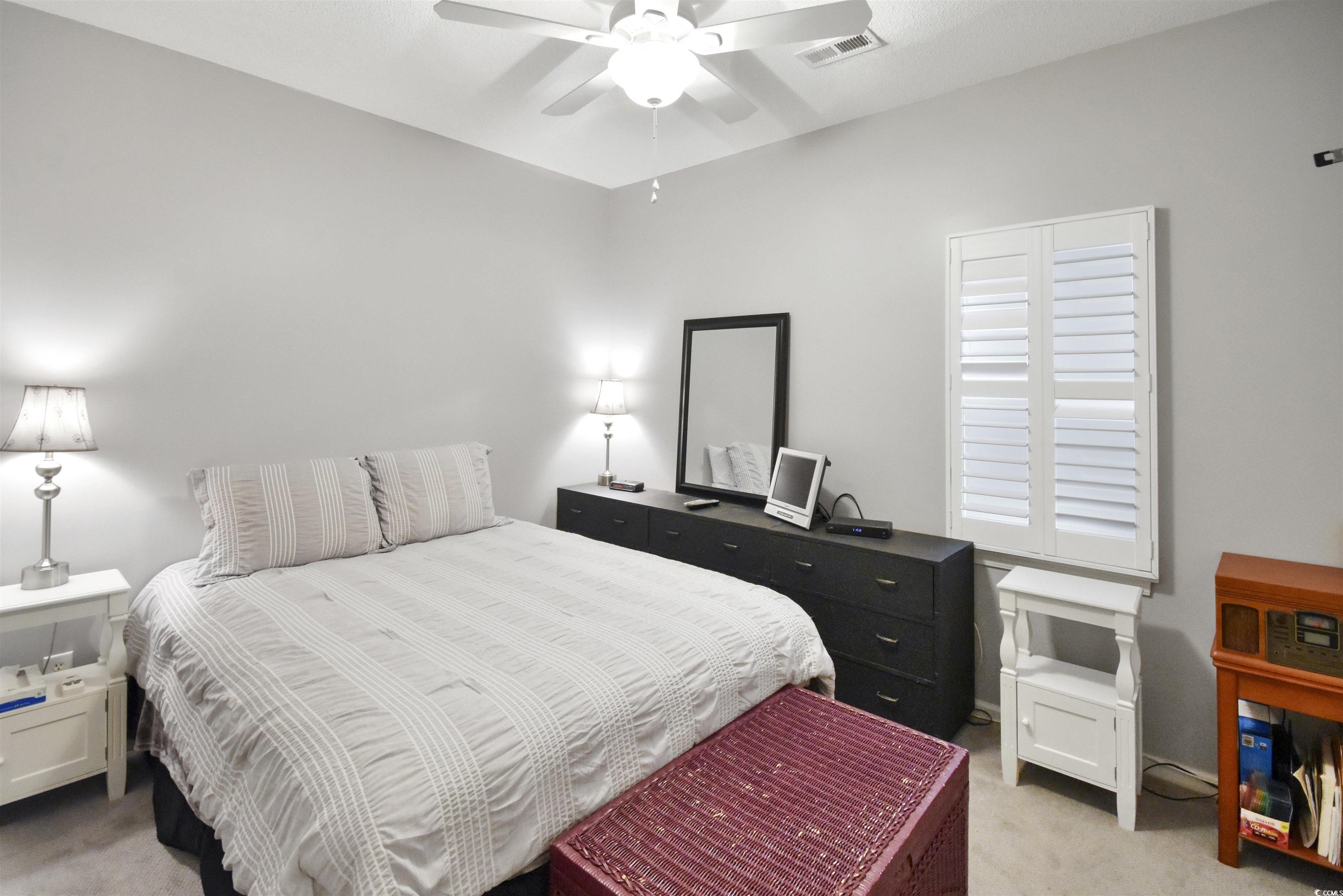 4502 Sweetwater Boulevard, Unit 4502 Murrells Inlet, SC 29576 - Photo 10 of 28 Bedroom featuring light carpet and ceiling fan