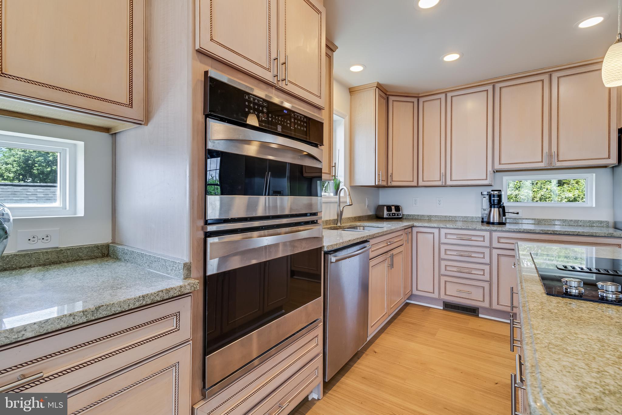 2818 Beach Drive Huntingtown, MD 20639 - Photo 13 of 74 a kitchen with stainless steel appliances granite countertop a stove and a sink