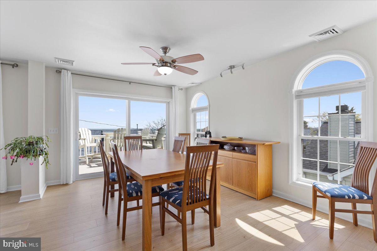 2818 Beach Drive Huntingtown, MD 20639 - Photo 15 of 74 a view of a dining room with furniture window and wooden floor