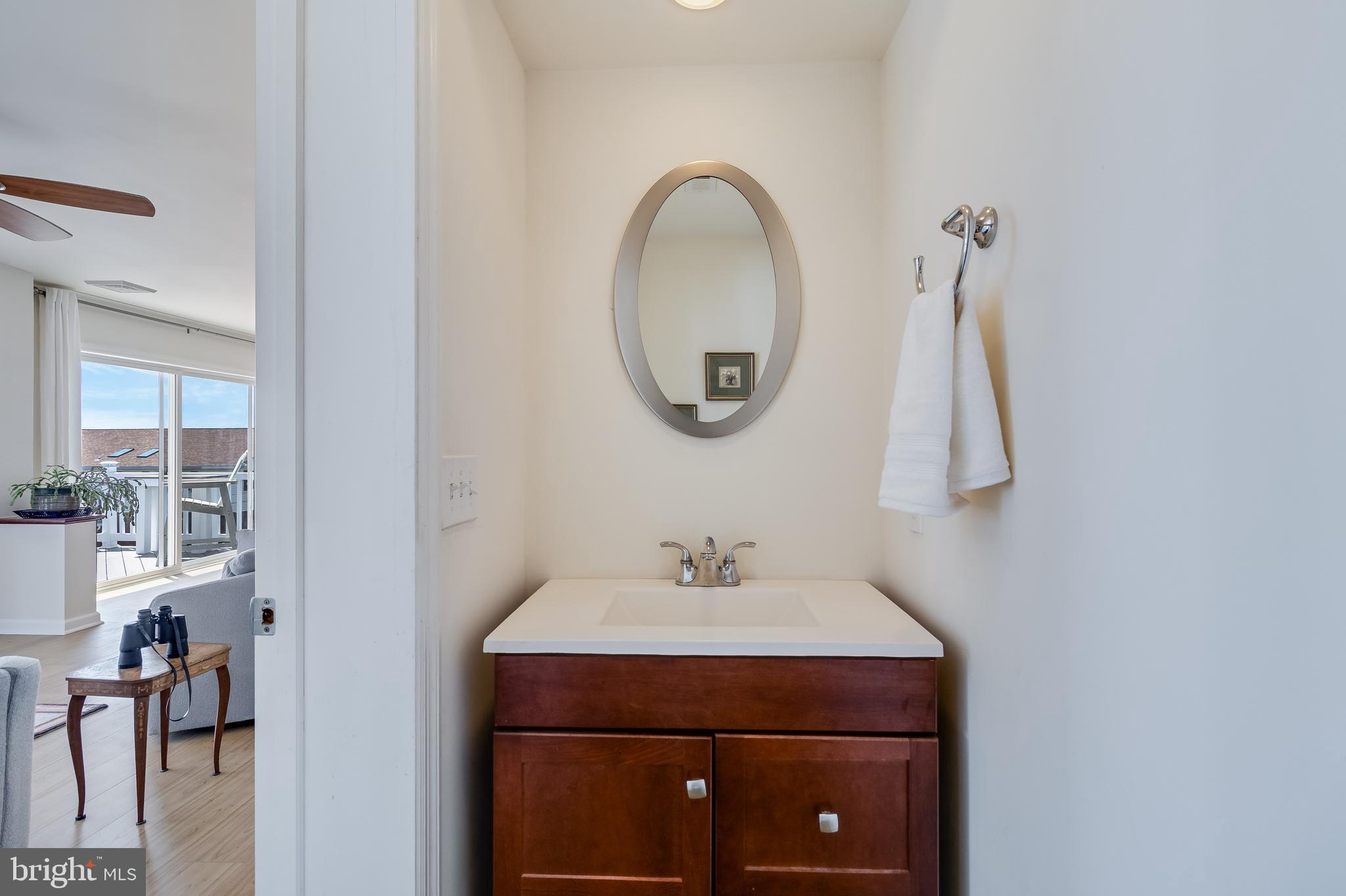 2818 Beach Drive Huntingtown, MD 20639 - Photo 22 of 74 a bathroom with a sink and a mirror