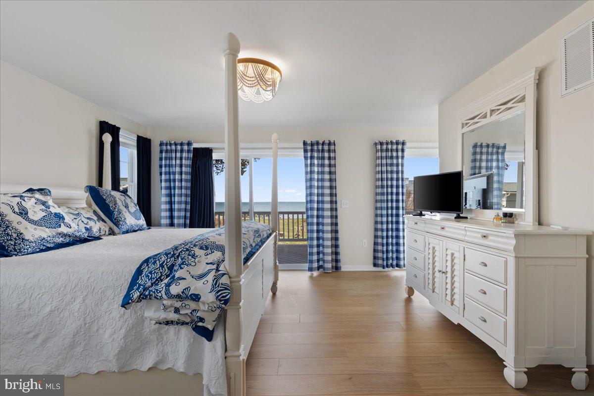 2818 Beach Drive Huntingtown, MD 20639 - Photo 23 of 74 a bedroom with furniture and flat screen tv