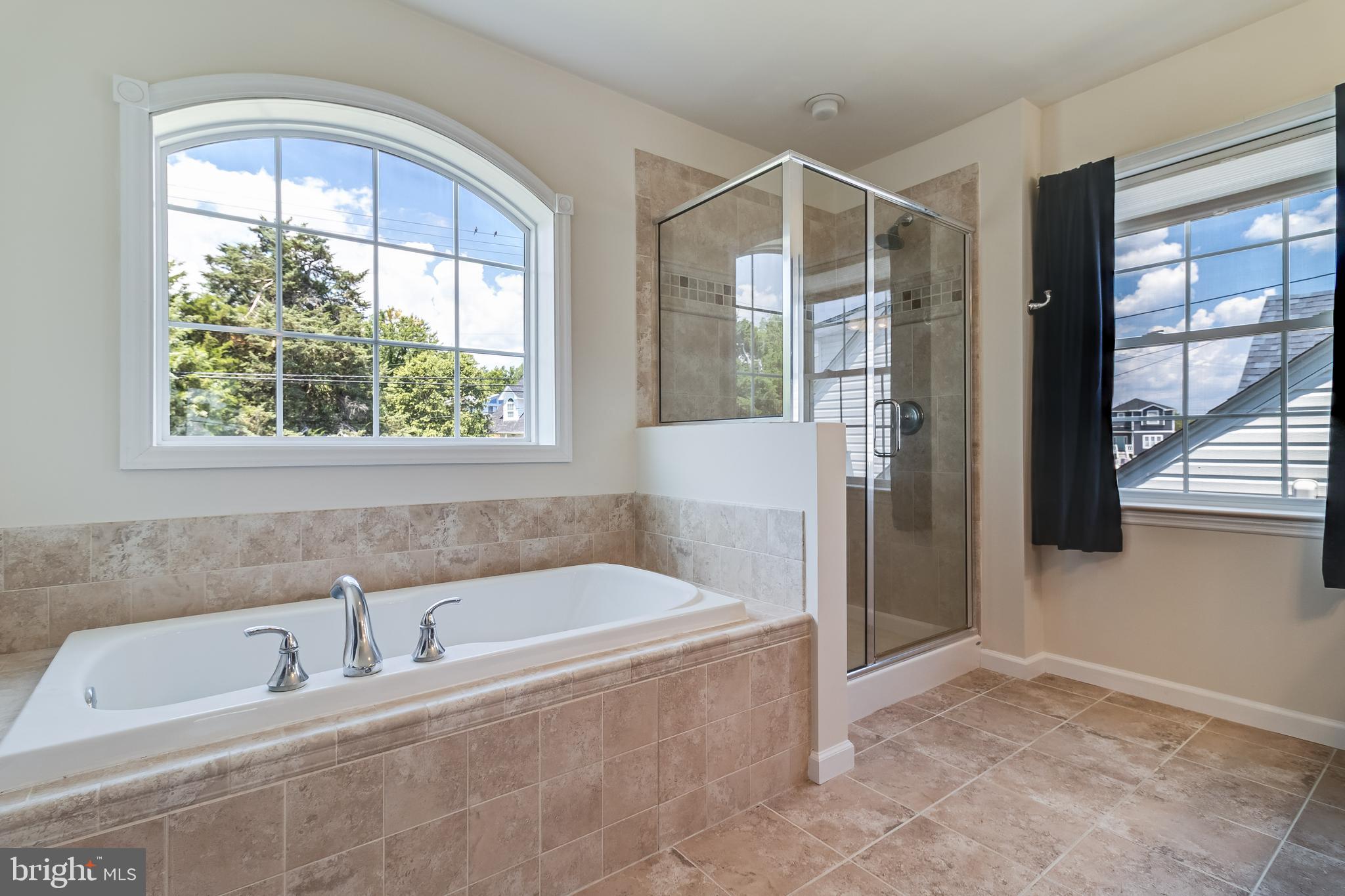 2818 Beach Drive Huntingtown, MD 20639 - Photo 27 of 74 a bathroom with a bathtub and a shower