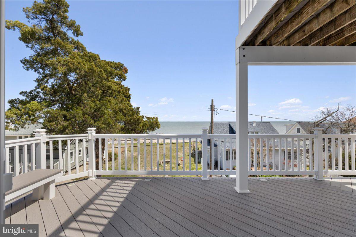 2818 Beach Drive Huntingtown, MD 20639 - Photo 30 of 74 a view of a wooden deck with a yard