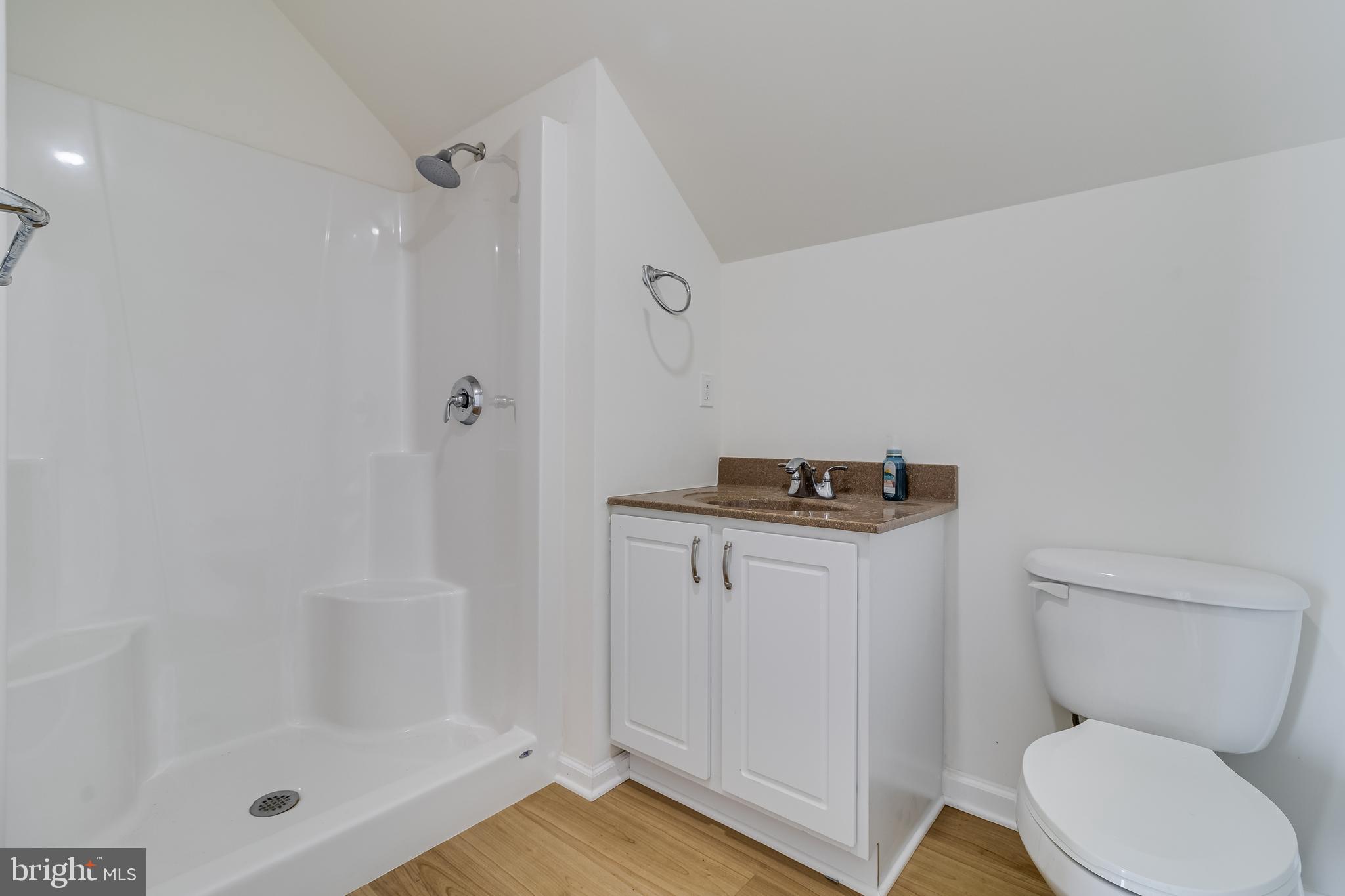 2818 Beach Drive Huntingtown, MD 20639 - Photo 45 of 74 a bathroom with a toilet a sink and shower