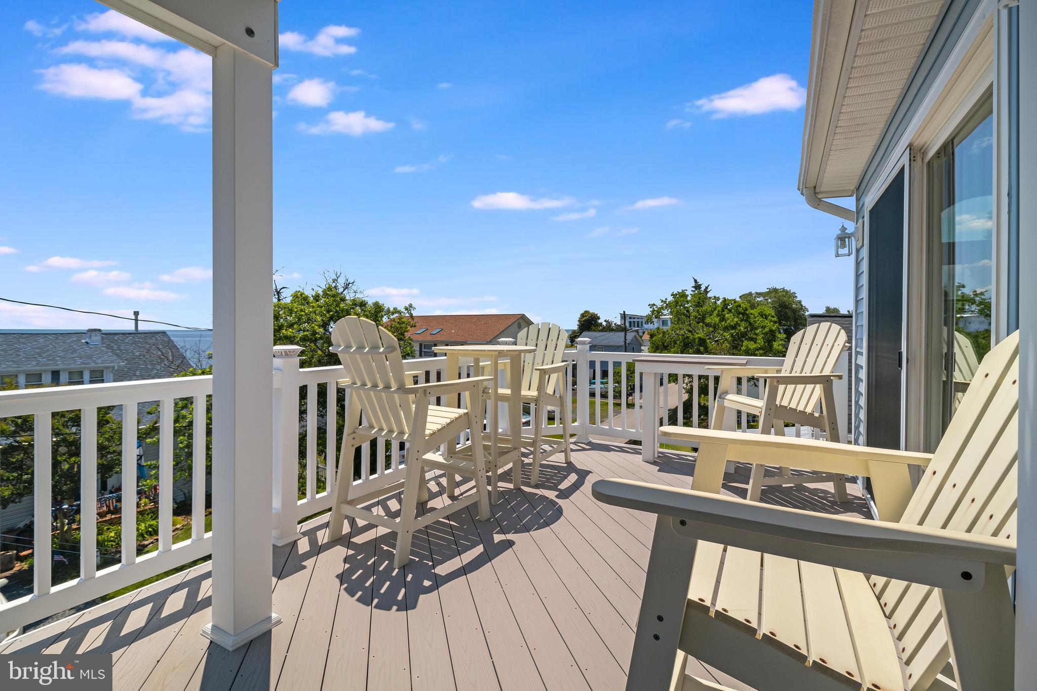 2818 Beach Drive Huntingtown, MD 20639 - Photo 53 of 74 a view of a balcony with wooden floor and outdoor seating