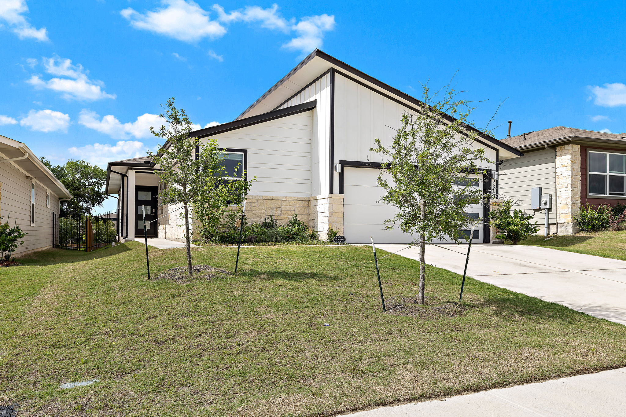 2313 Ranier Court Austin, TX 78754 - Photo 3 of 22 a view of house with a big yard and potted plants
