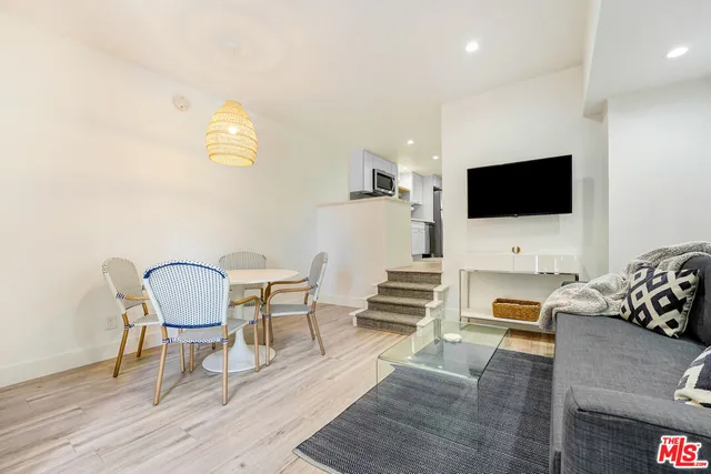 a kitchen with stainless steel appliances a stove sink microwave and cabinets