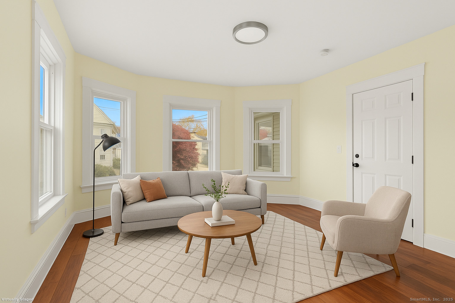 90 Amsterdam Avenue, Unit 1 Bridgeport, CT 06606 - Photo 1 of 14 a living room with furniture and a large window