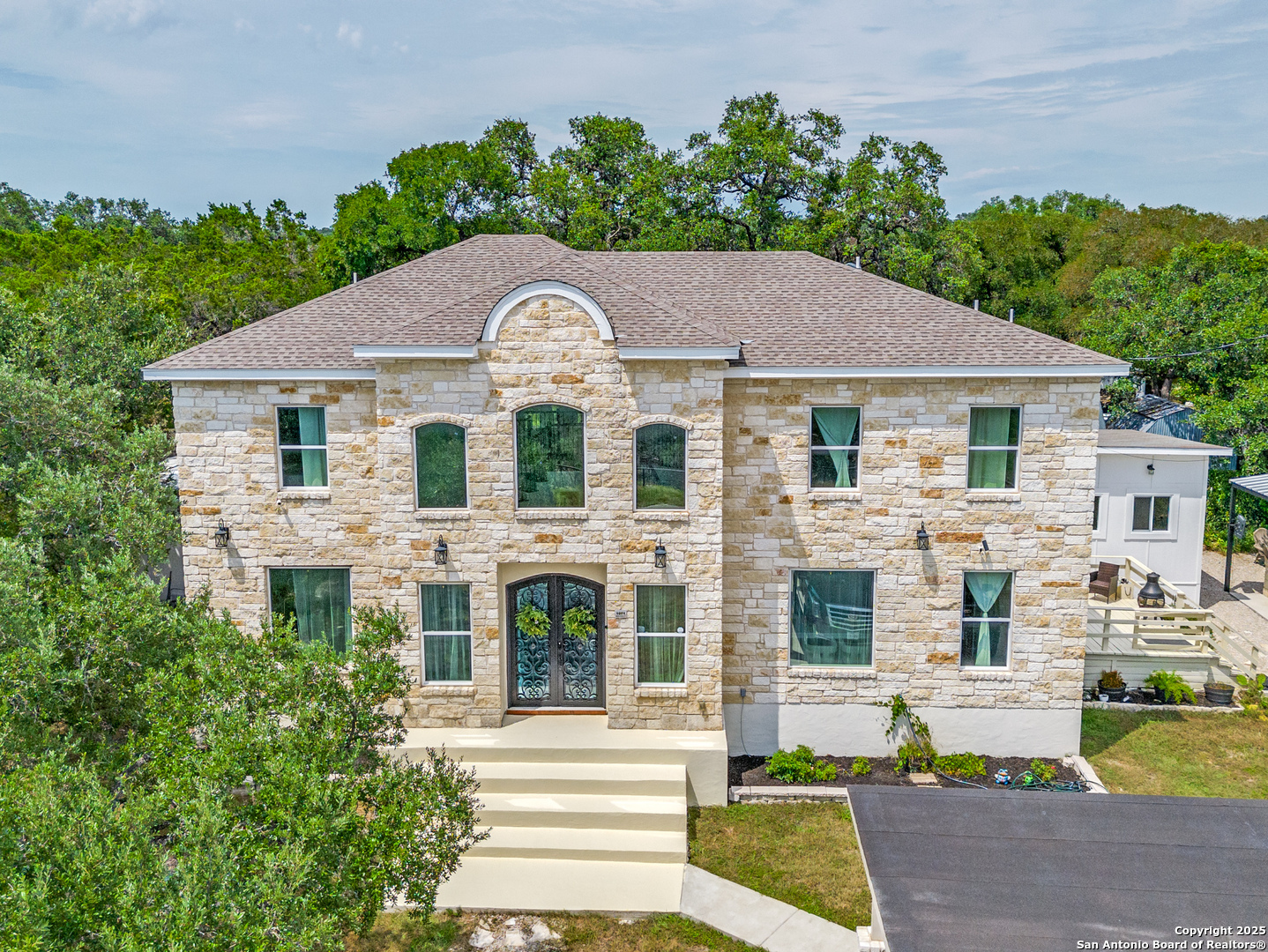 1071 Hidden Valley Drive Spring Branch, TX 78070 - Photo 1 of 30 a front view of a house with garden