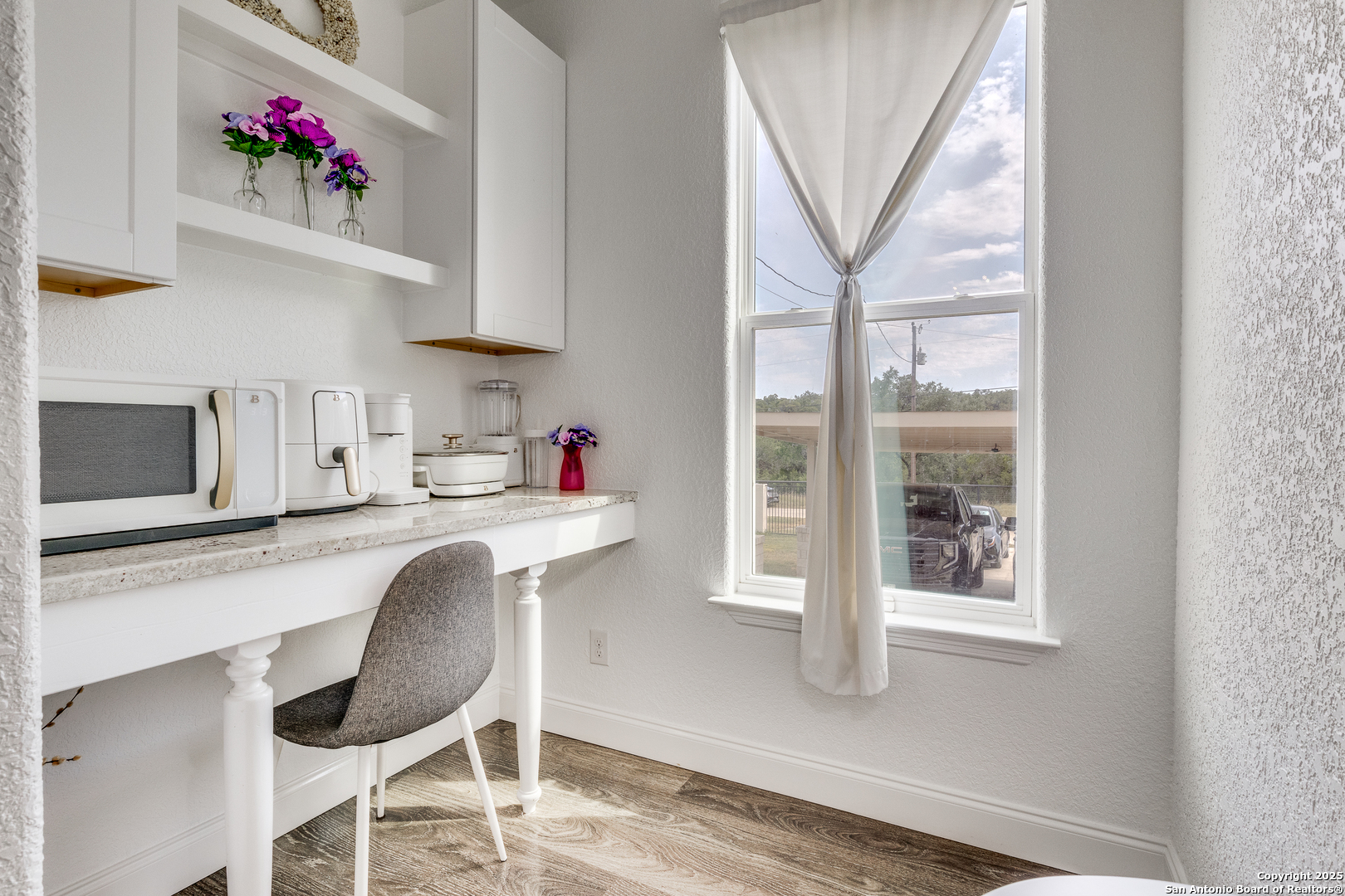1071 Hidden Valley Drive Spring Branch, TX 78070 - Photo 12 of 30 a kitchen with granite countertop a sink cabinets and wooden floor
