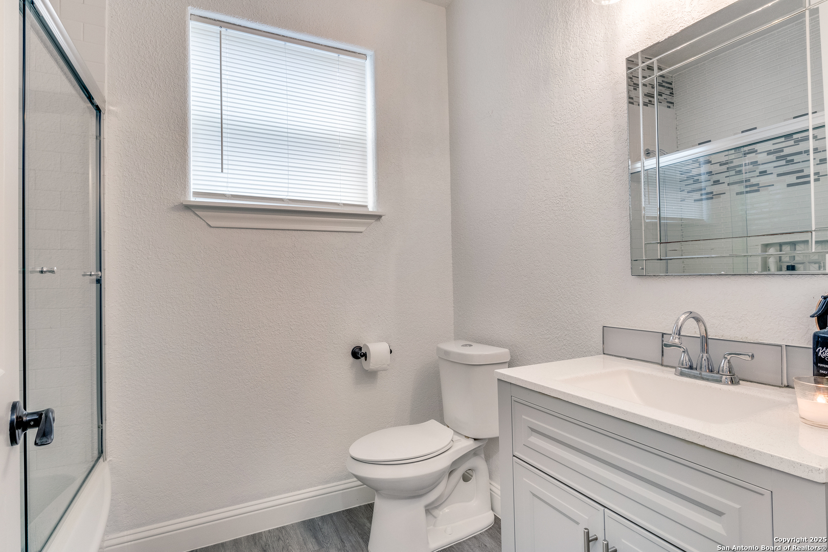 1071 Hidden Valley Drive Spring Branch, TX 78070 - Photo 14 of 30 a bathroom with a sink toilet and a mirror
