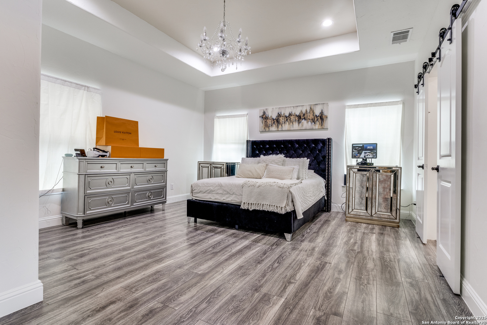 1071 Hidden Valley Drive Spring Branch, TX 78070 - Photo 15 of 30 a bedroom with a bed and a wooden floor