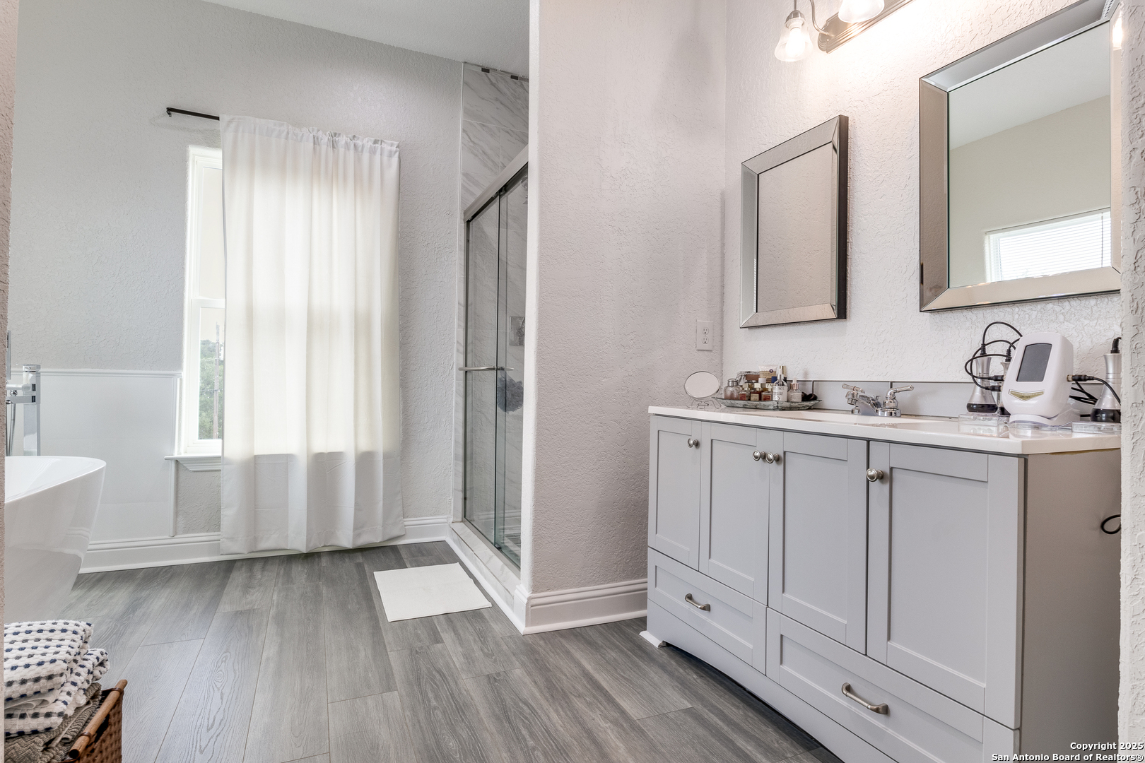 1071 Hidden Valley Drive Spring Branch, TX 78070 - Photo 18 of 30 a bathroom with a sink and a mirror