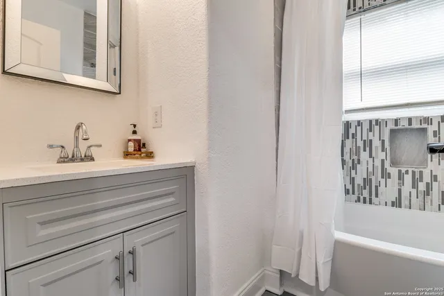 a bathroom with a sink and a bathtub