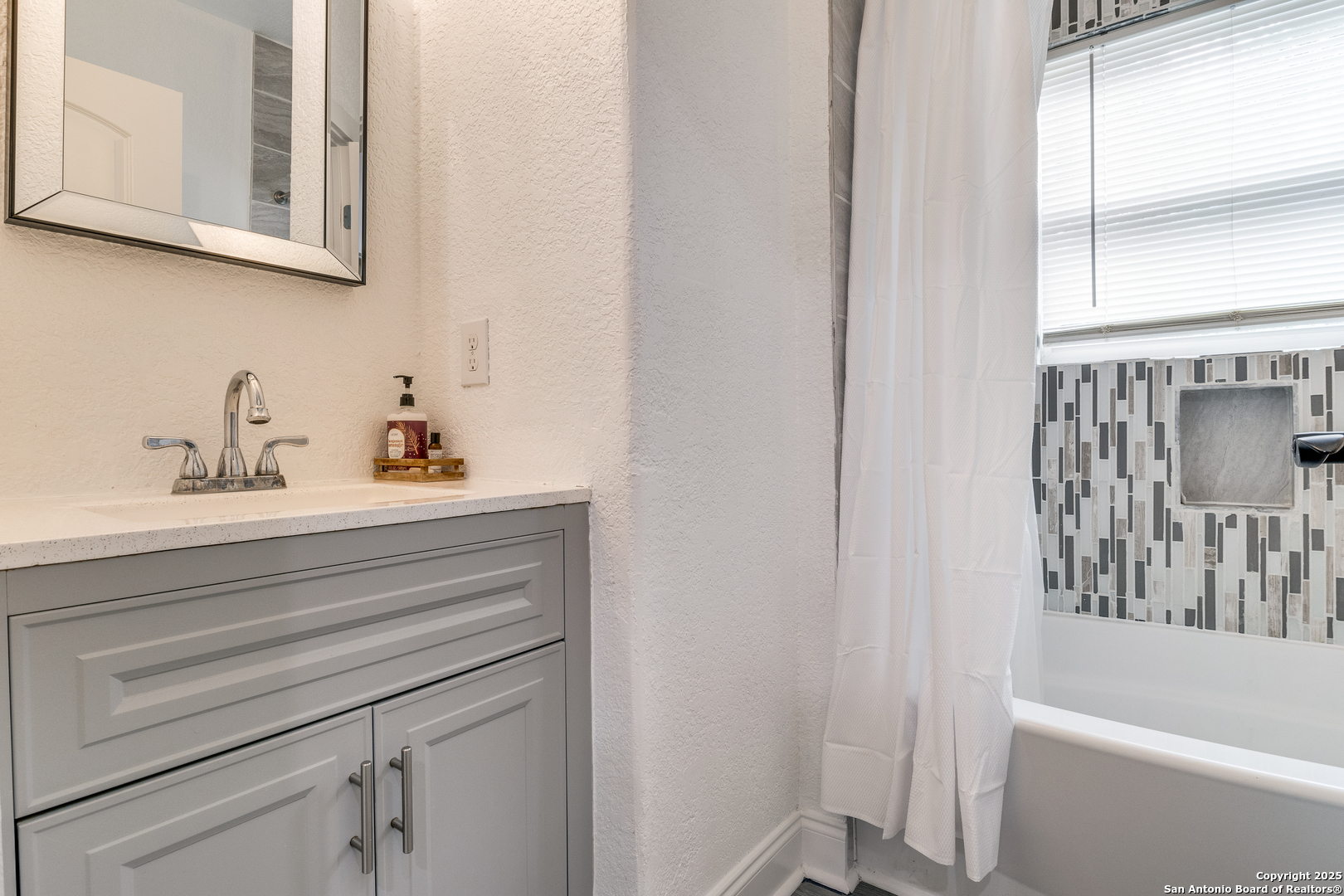 1071 Hidden Valley Drive Spring Branch, TX 78070 - Photo 22 of 30 a bathroom with a sink and a bathtub