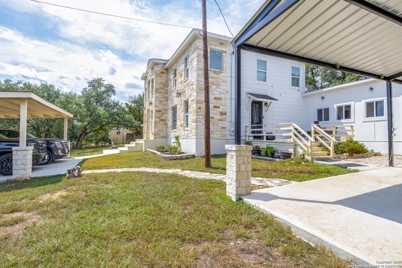 1071 Hidden Valley Drive Spring Branch, TX 78070 - Photo 25 of 30 a view of a house with backyard and a tree