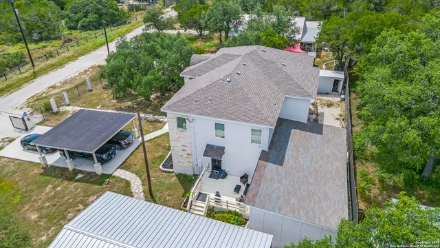 a view of a house with a yard and a garage