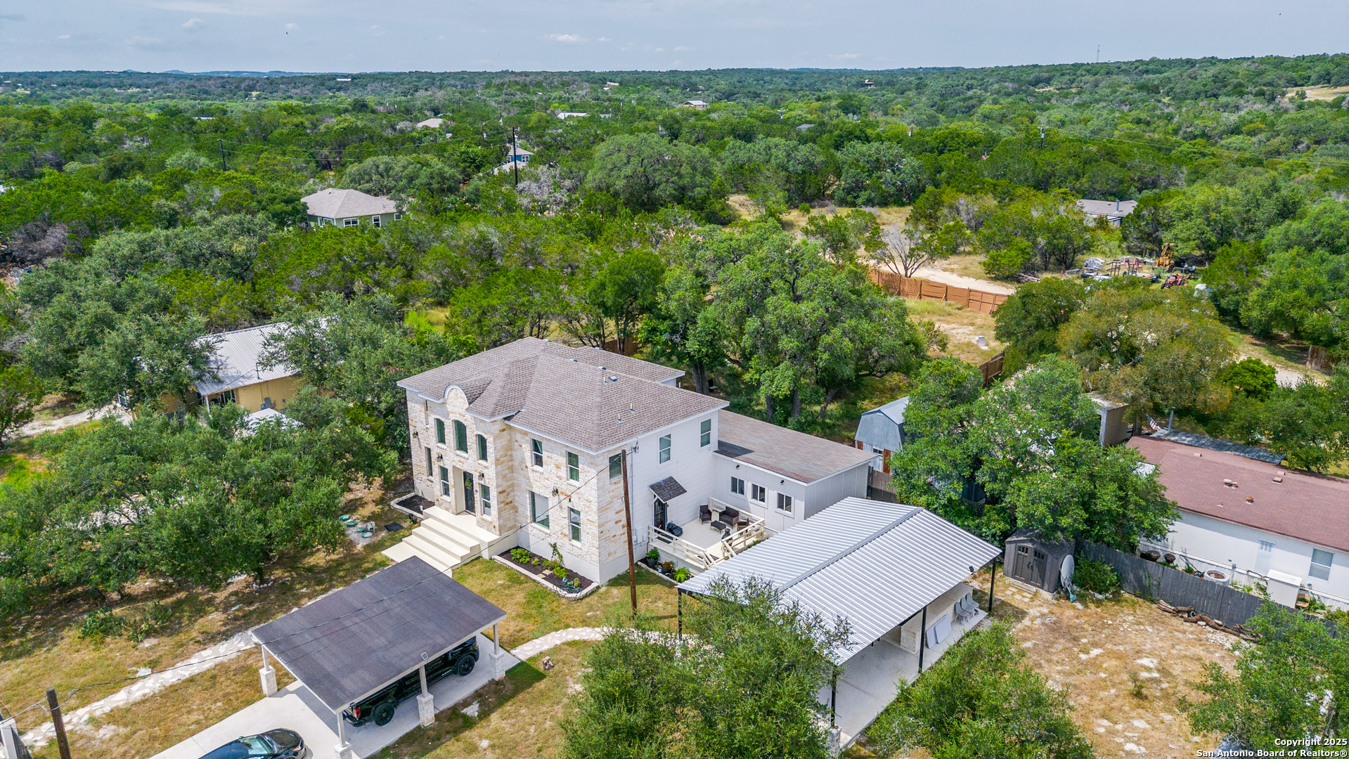 1071 Hidden Valley Drive Spring Branch, TX 78070 - Photo 29 of 30 an aerial view of multiple houses with yard