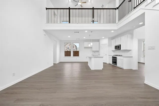 a view of kitchen with furniture and wooden floor