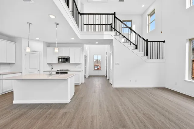 a view of kitchen with cabinets and wooden floor