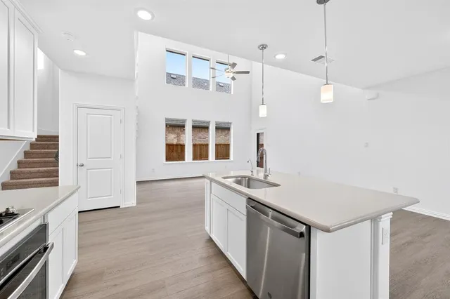 a kitchen with a sink and stove