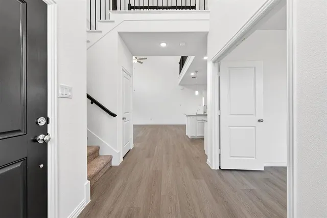 a view of entryway with wooden floor
