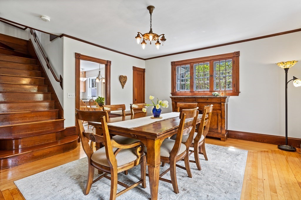 256 Great Road Stow, MA 01775 - Photo 13 of 42 a view of a dining room with furniture and a chandelier