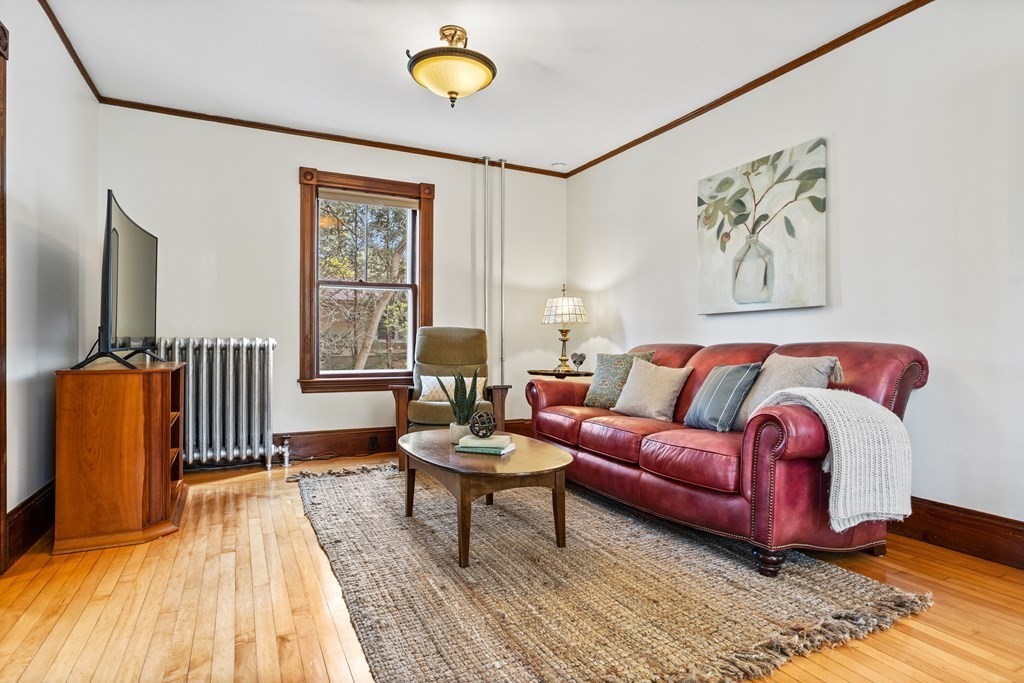 256 Great Road Stow, MA 01775 - Photo 20 of 42 a living room with furniture and a flat screen tv