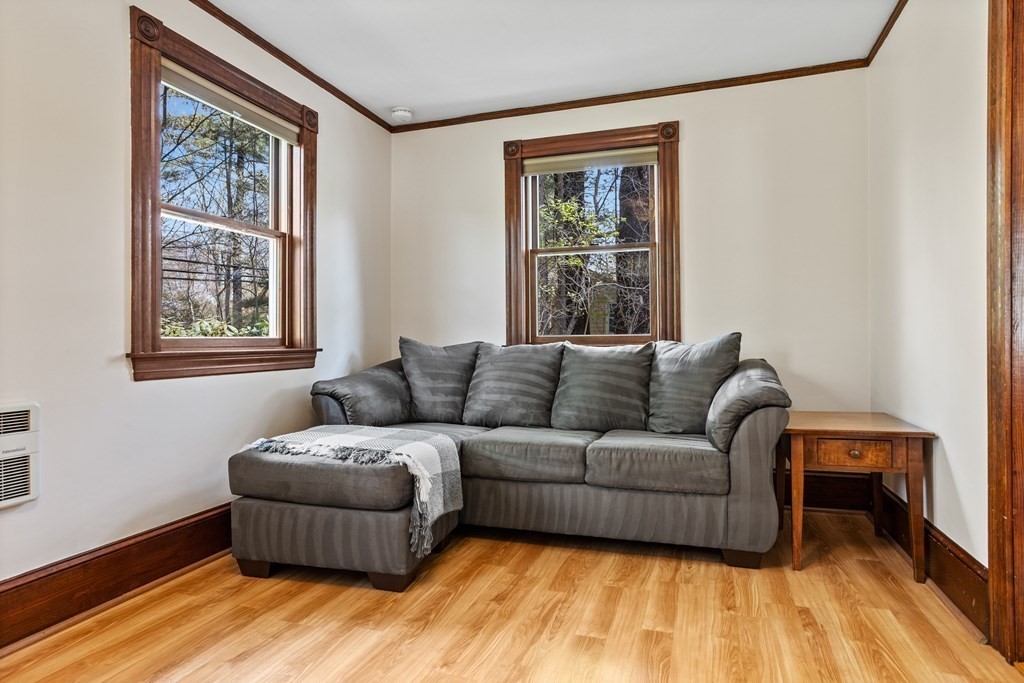 256 Great Road Stow, MA 01775 - Photo 22 of 42 a living room with furniture and a window