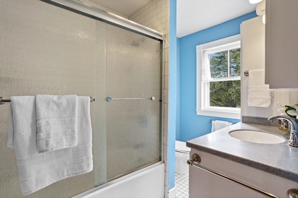 256 Great Road Stow, MA 01775 - Photo 27 of 42 a bathroom with a sink and a mirror