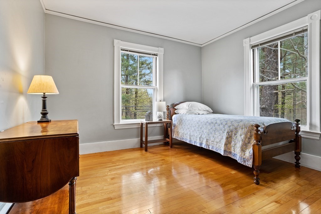 256 Great Road Stow, MA 01775 - Photo 30 of 42 a bedroom with a bed and a window