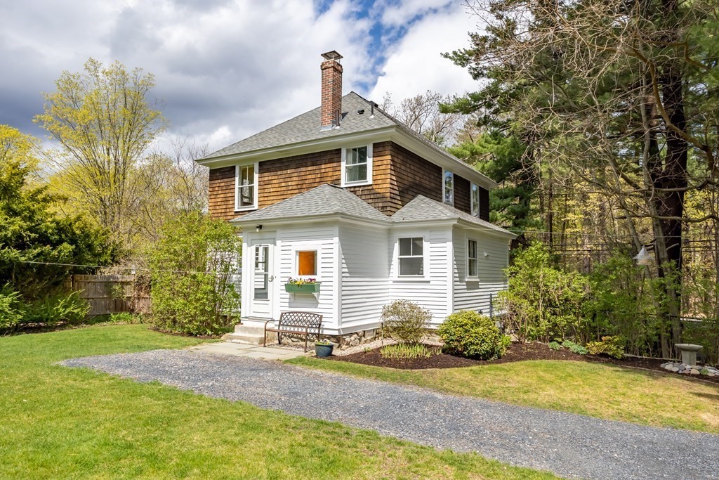 256 Great Road Stow, MA 01775 - Photo 3 of 42 a front view of a house with a yard