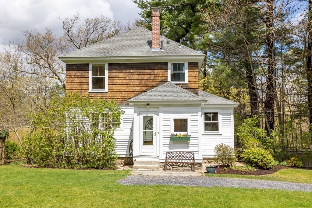 256 Great Road Stow, MA 01775 - Photo 32 of 42 front view of a house with a yard