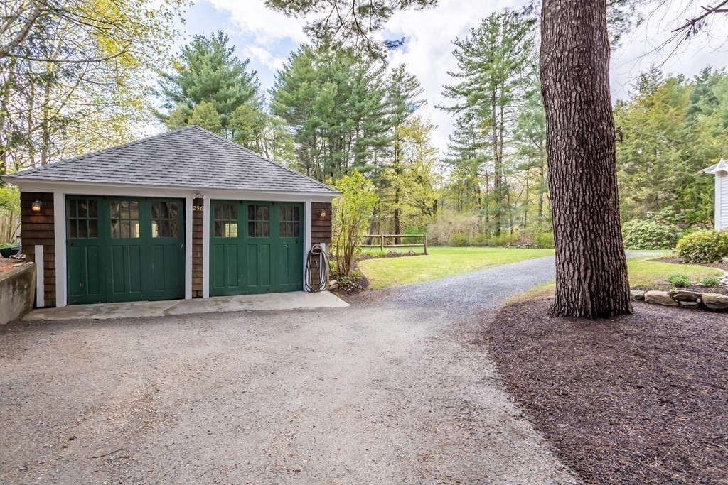 256 Great Road Stow, MA 01775 - Photo 37 of 42 a view of a house with a yard and large tree