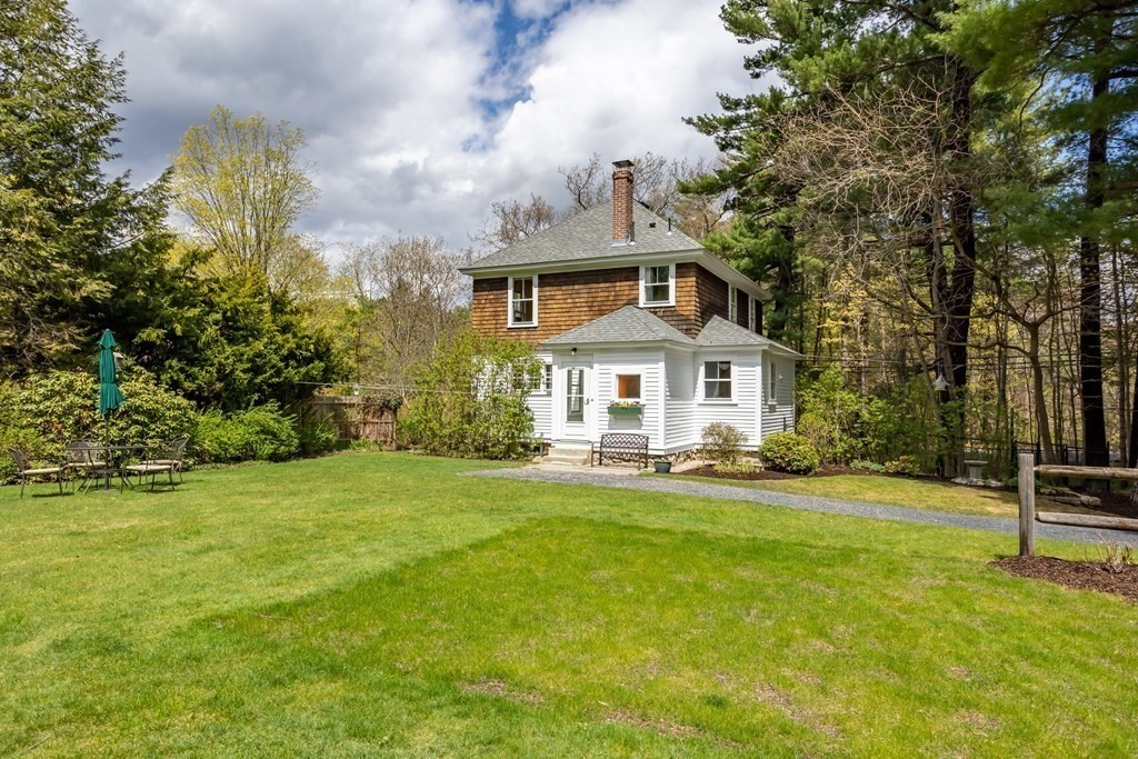 256 Great Road Stow, MA 01775 - Photo 38 of 42 a front view of a house with a yard