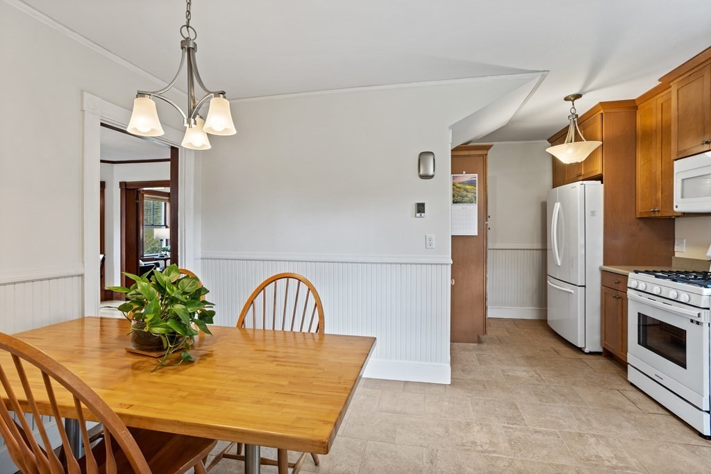 256 Great Road Stow, MA 01775 - Photo 9 of 42 a view of a dining room with furniture and a chandelier
