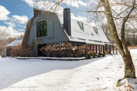 a view of a house with snow in the yard
