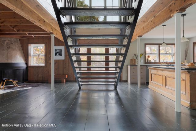 a view of entryway with stairs and wooden floor