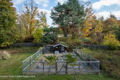 a view of house with outdoor space and lake view