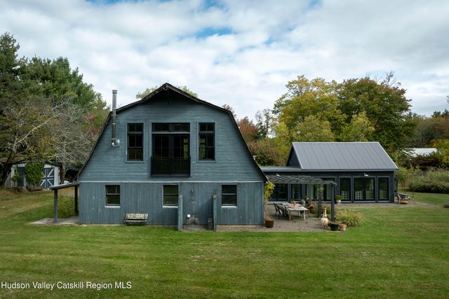 a view of living room with a table and windows