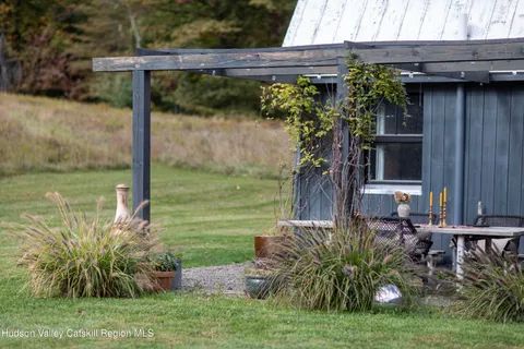 a backyard of a house with seating space