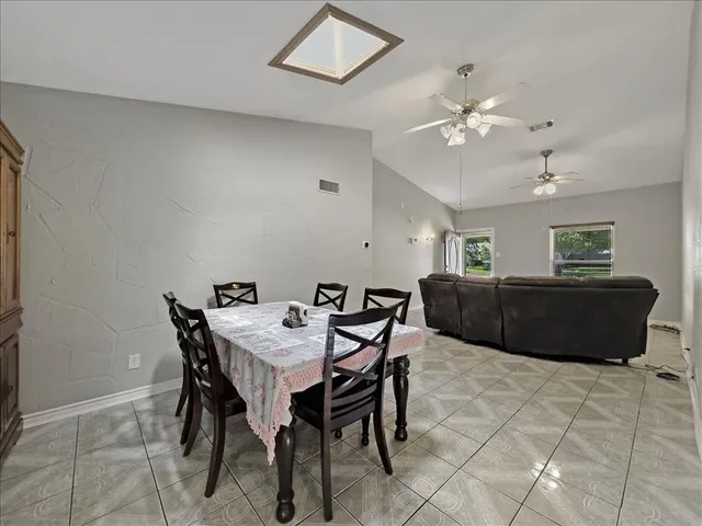 a view of a dining room with furniture