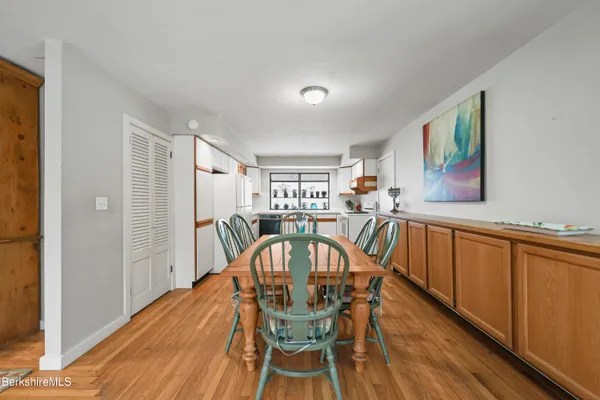 a view of a dining room with furniture window and wooden floor