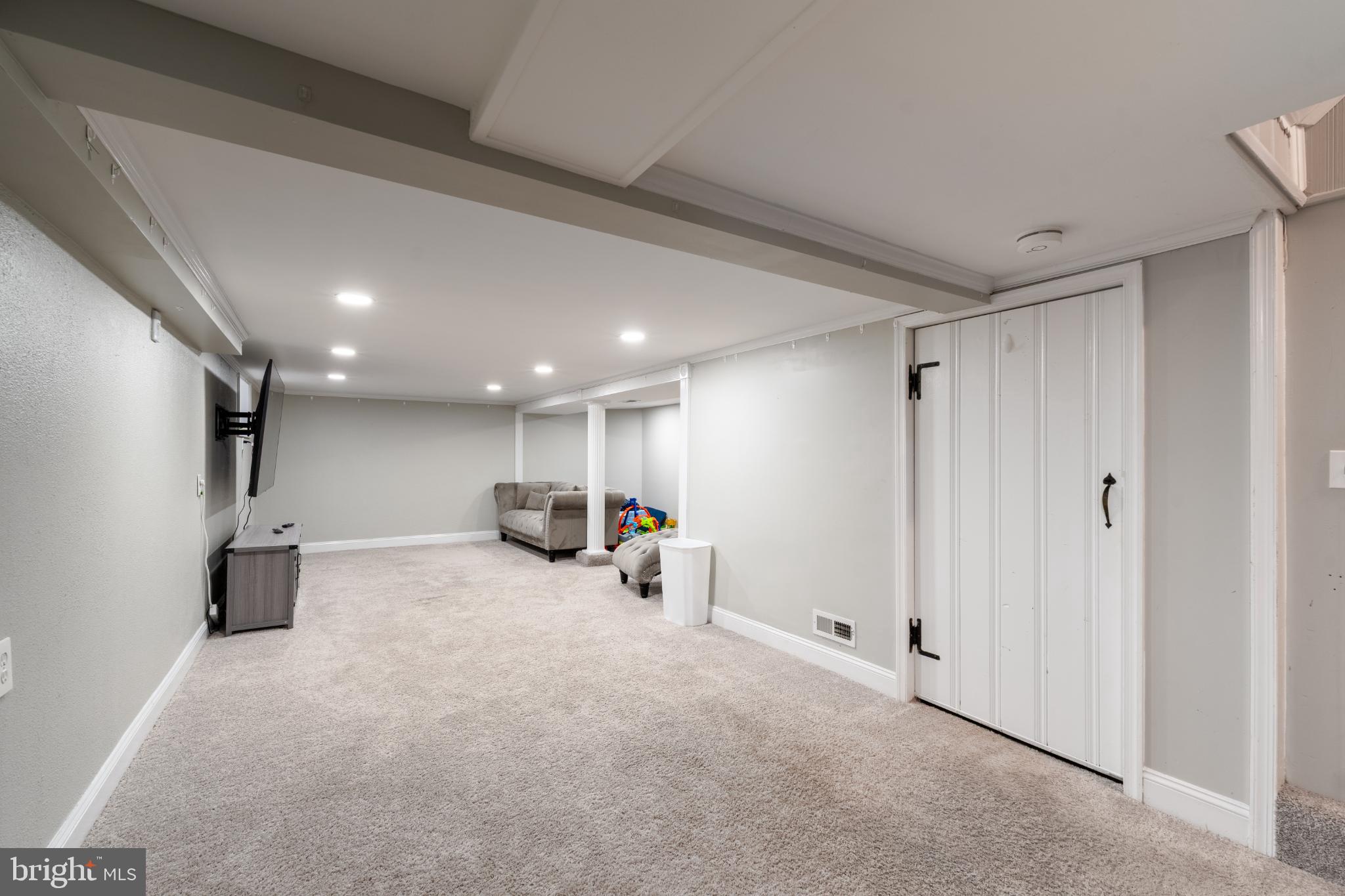 2519 Wycliffe Road Parkville, MD 21234 - Photo 19 of 26 a view of a livingroom with furniture and a refrigerator