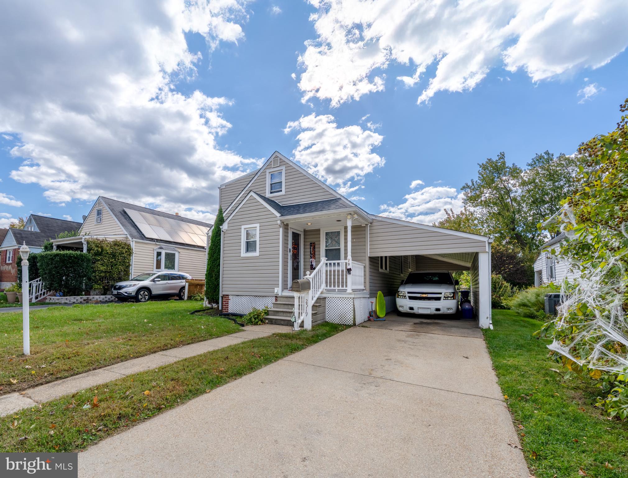 2519 Wycliffe Road Parkville, MD 21234 - Photo 2 of 26 a living room with a fireplace and a garden